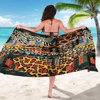 Draped animal print sarong with black ground and colorful wild-skin motif, wide wrap