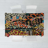 Black animal-print tablecloth with multicolor mixed wild animal and geometric motifs