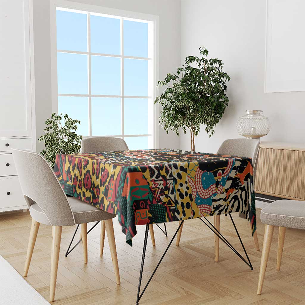 Black wild animal pattern tablecloth draped over dining table with colorful artwork