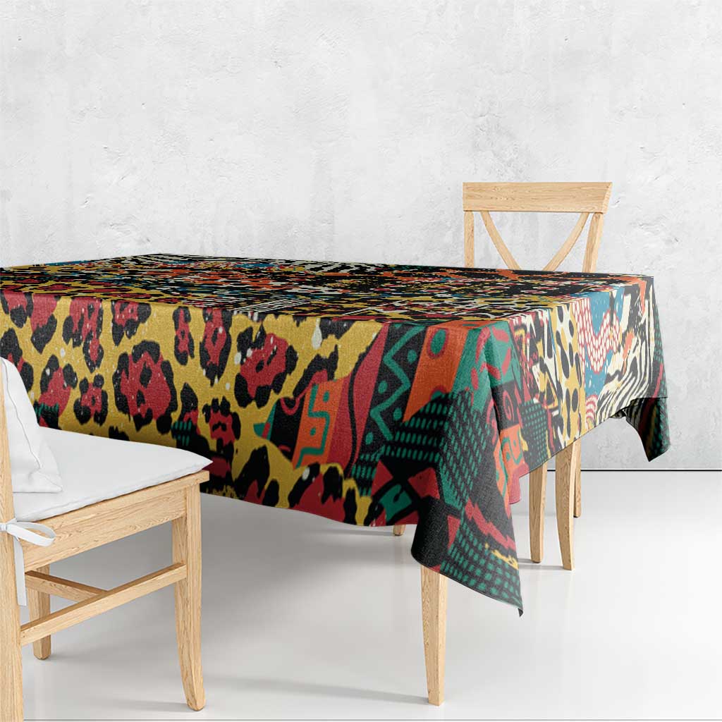 Black animal-print tablecloth corner drape with colorful geometric and spot motifs
