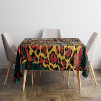 Black wild animal mix tablecloth with bright multicolor spots, lines, and blocks