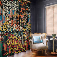 Colorful animal-print window curtains with black accents, long hanging panels