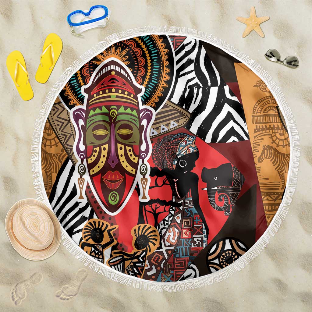 Round beach blanket with red, black, and white African motif print and white fringe edge