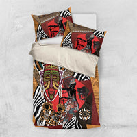African motif duvet cover and pillows set in red, black, and tan with zebra stripe patterns