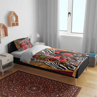 Bedding set with red, tan and black African portrait artwork and zebra stripe detail on duvet