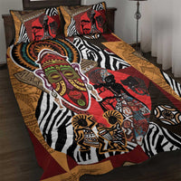 African motif quilt bed set with red, black, white, and tan tribal designs and zebra stripes