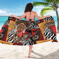 African-patterned sarong featuring zebra stripes, central face artwork, red and tan geometric blocks