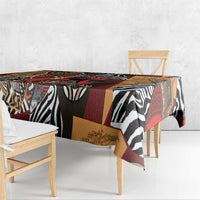 African-pattern tablecloth draped over table edge, zebra stripes and geometric blocks