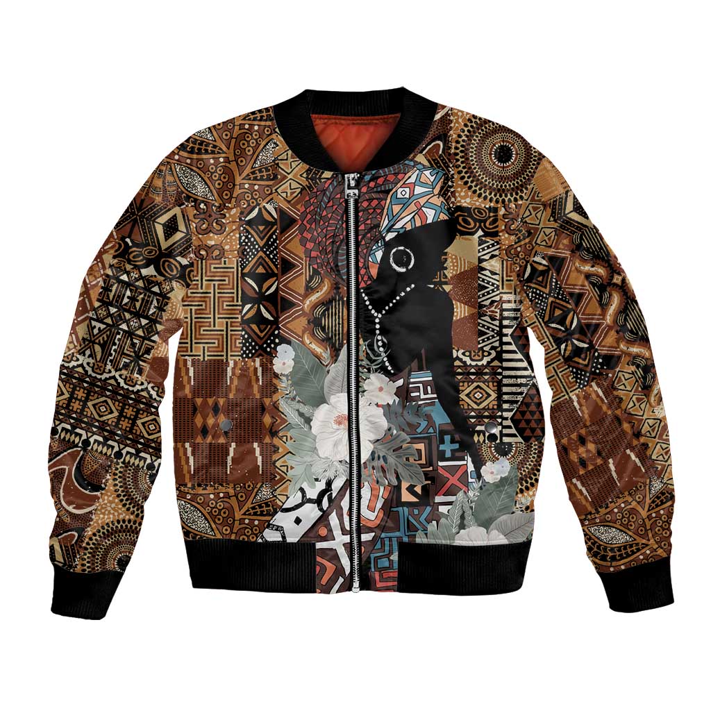 Brown tribal print bomber jacket with black ribbed collar, cuffs, hem, and front zipper
