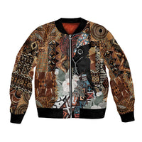 Brown tribal print bomber jacket with black ribbed collar, cuffs, hem, and front zipper