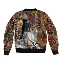 Brown bomber jacket with large central graphic, black ribbed cuffs and hem, front zipper