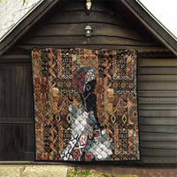 Brown tribal quilt hanging in doorway, geometric pattern, black face design, white floral accents