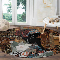 Round rug with black portrait and floral bouquet, brown geometric border