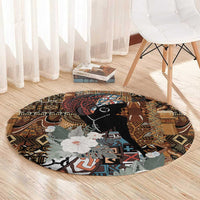 Round rug with black portrait centerpiece, tribal motifs and gray floral design on brown