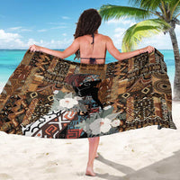 Black and brown African patterned sarong wrap draped open, floral and animal motif