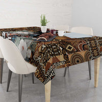 Rectangular tablecloth with dark tribal print, geometric motifs, and pale flower accents