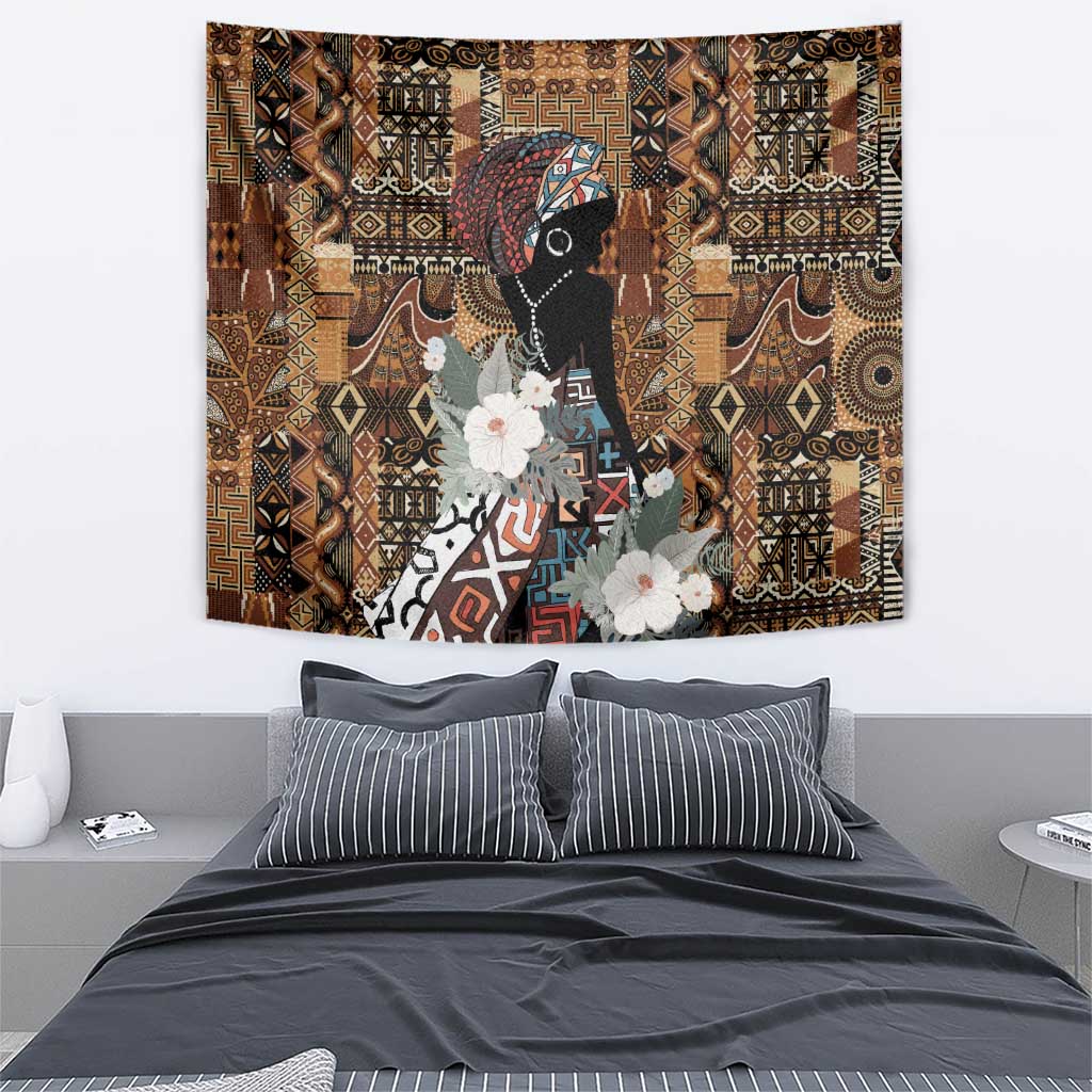 African tribal wall tapestry featuring black woman portrait, patchwork geometric motifs, white flowers