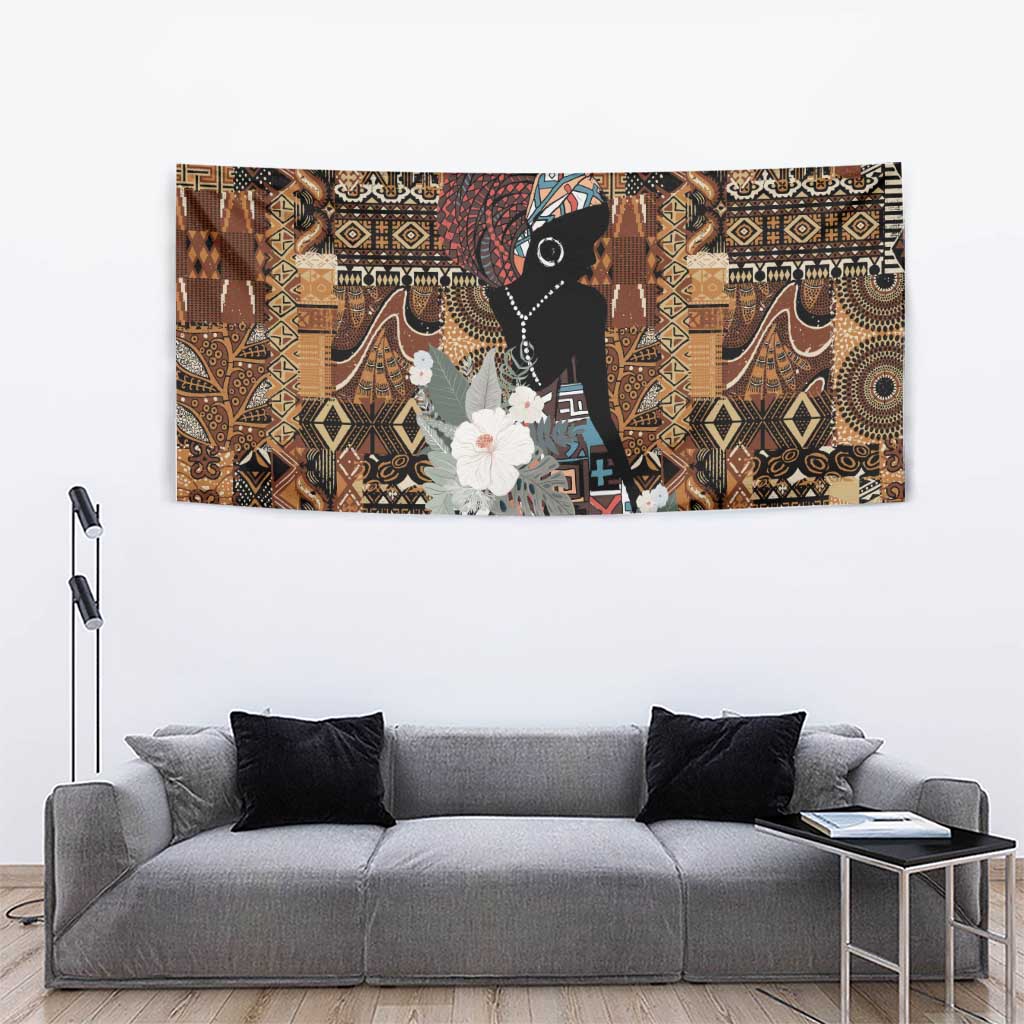 African tribal wall tapestry showing black woman portrait with white flowers and geometric motifs