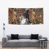 African tribal wall tapestry showing black woman portrait with white flowers and geometric motifs