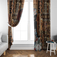 Window curtain pair with dark tribal print and floral woman motif, hanging beside white frame