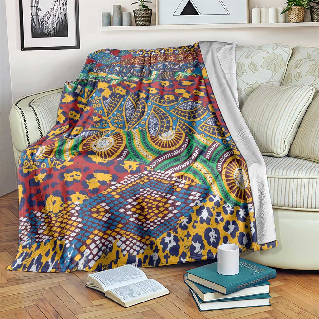 Multicolor animal-skin pattern blanket draped over a sofa, with bold geometric motifs