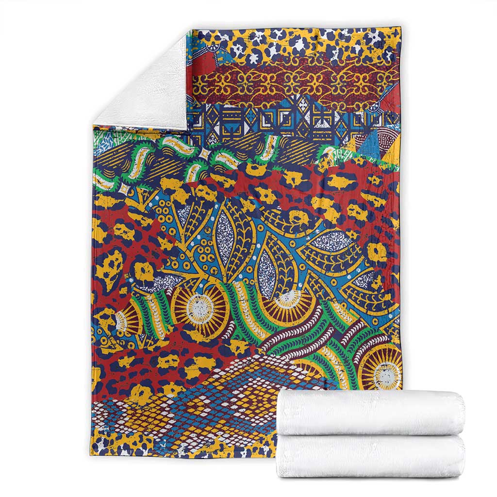 Animal-skin pattern blanket shown folded with multicolor ornate motifs and geometric bands