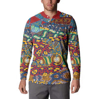 Multicolor patterned button-up sweatshirt with red collar, worn by model