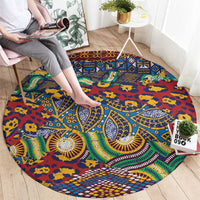 Round tribal rug laid on floor, blue animal-skin pattern with red, yellow, and green