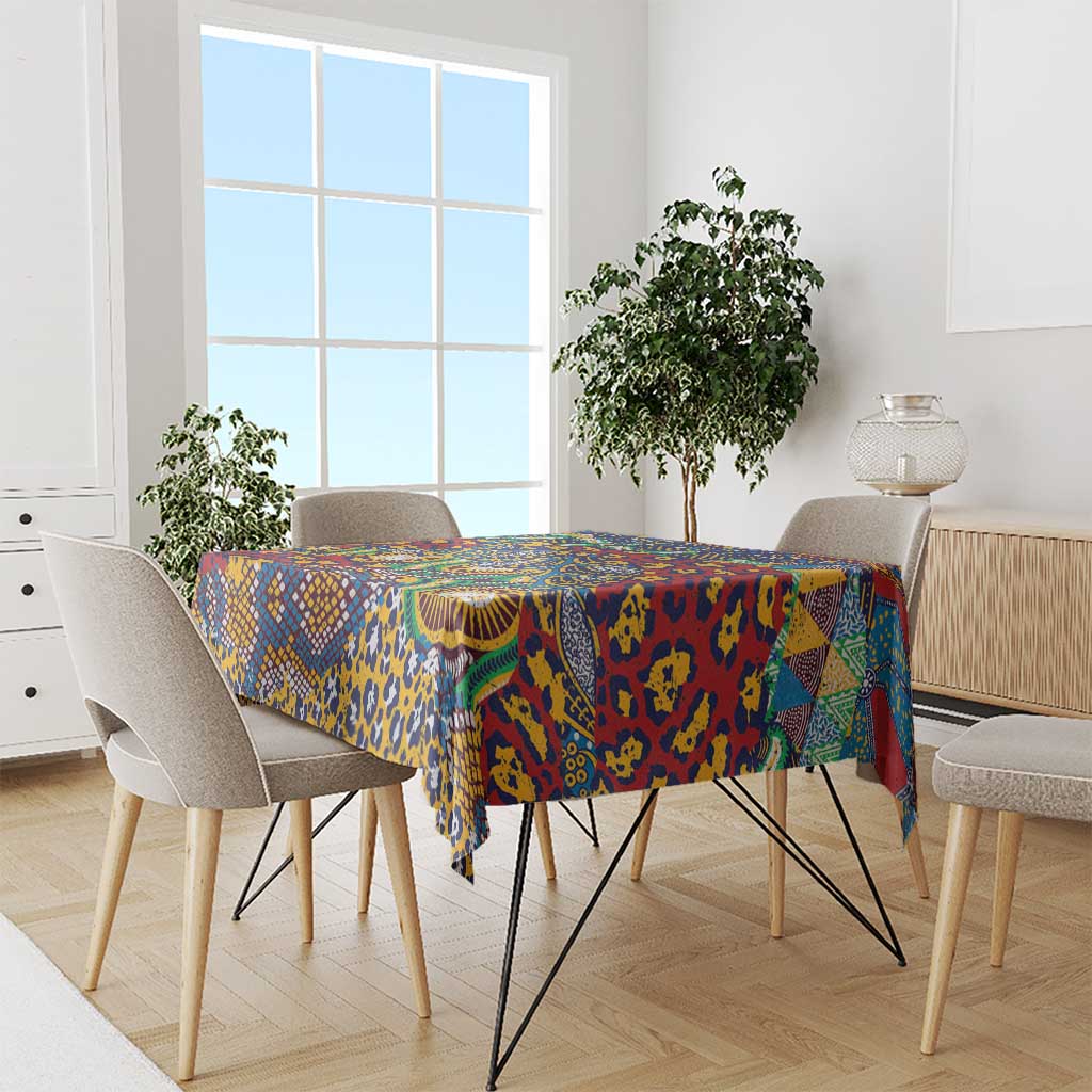 Animal-skin pattern tablecloth in blue, yellow, red, and green on a dining table