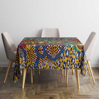 Blue animal-skin print tablecloth with multicolor geometric pattern across the top