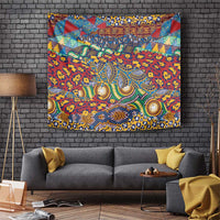 Red animal-skin pattern tapestry with colorful central figures and geometric border