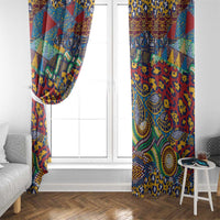 Two red-based patterned window curtains framing a white door and window