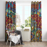 Two floor-length patterned window curtains with bold multicolor animal-skin style design