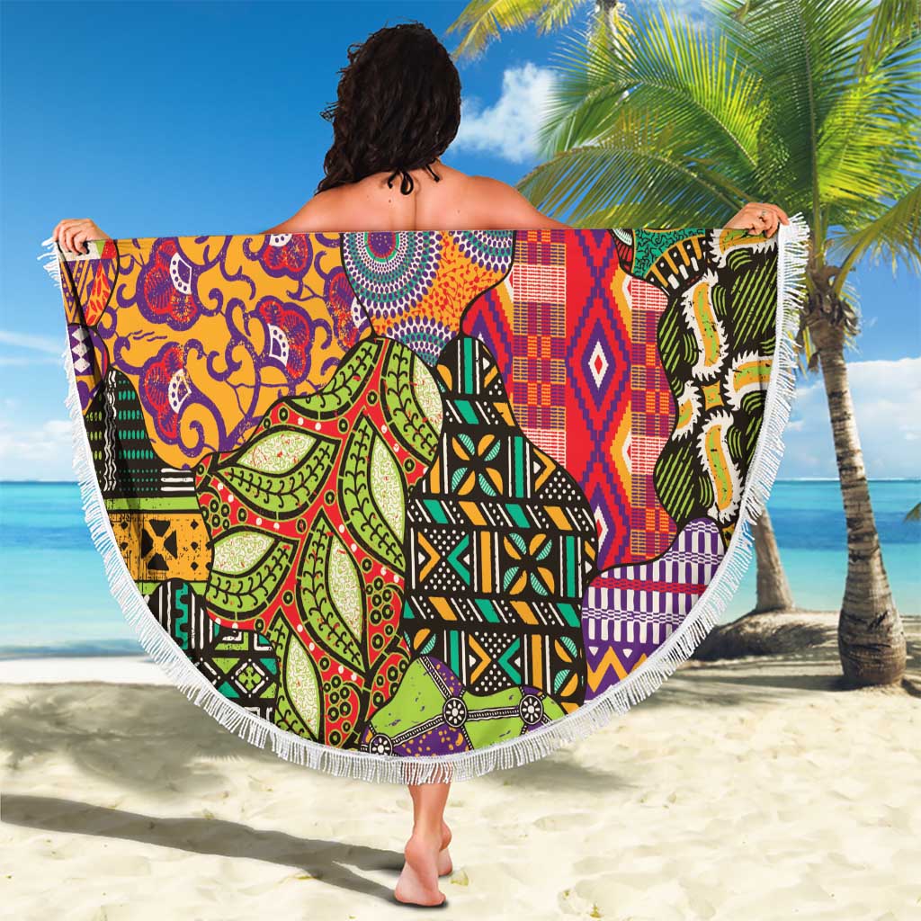 Round beach blanket draped over shoulders, featuring colorful tribal motifs and white fringe