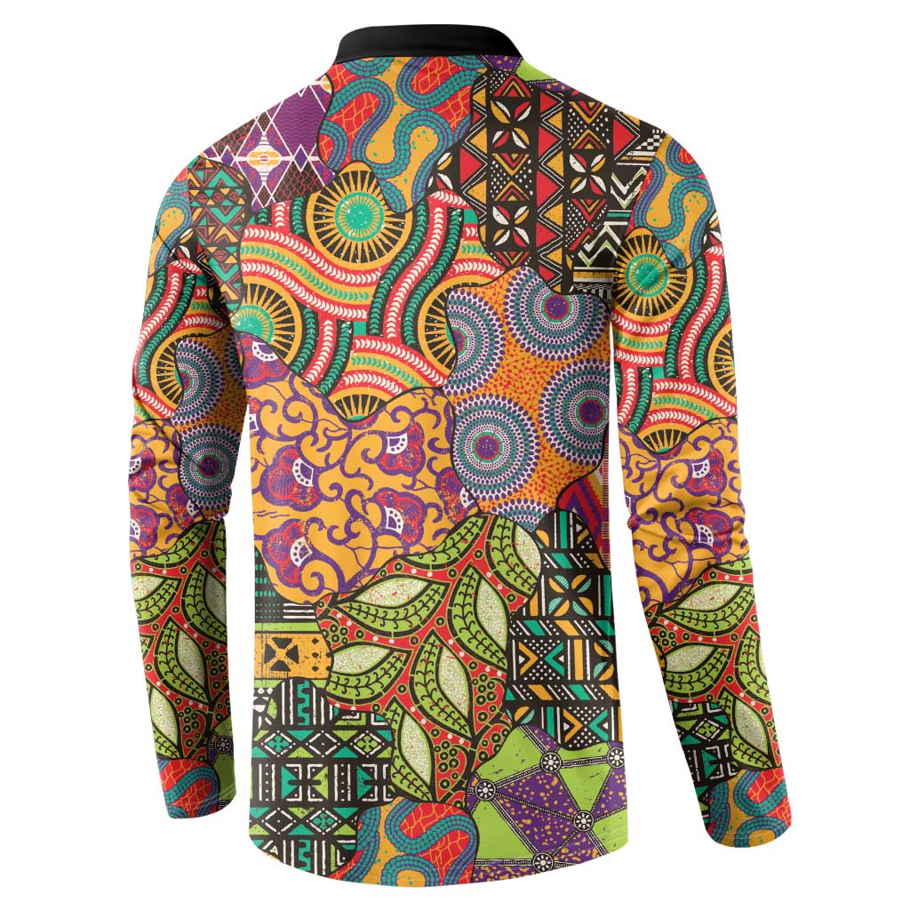 Button-front sweatshirt with black collar; multicolor African motif back print, long sleeves.
