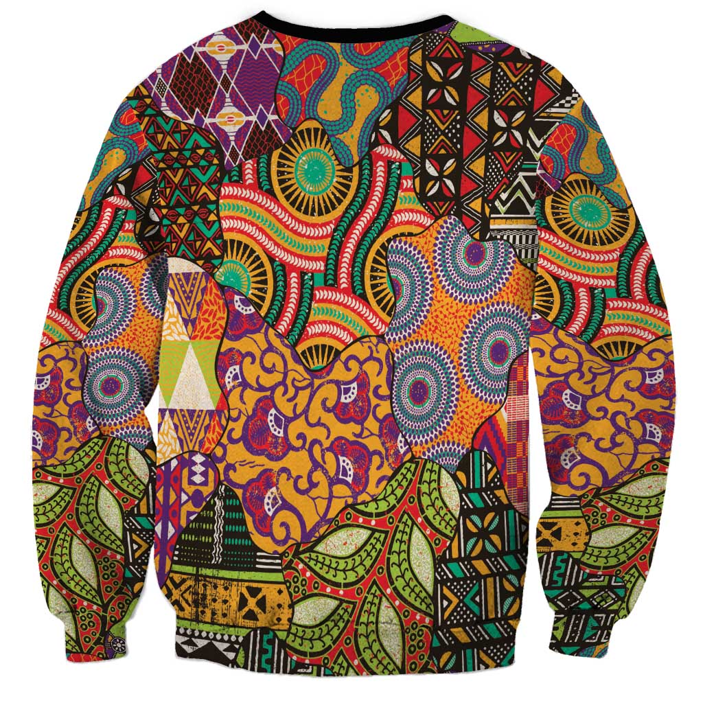 Crewneck sweatshirt with colorful folk-style pattern panels, black collar and cuffs