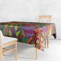Multicolor geometric motif tablecloth covering a dining bench and tabletop