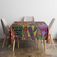 Multicolor ethnic patterned tablecloth on a square dining table with matching motifs