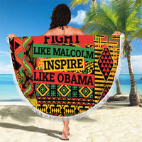 Round beach blanket with white fringe, bold “FIGHT LIKE MALCOLM INSPIRE…” text