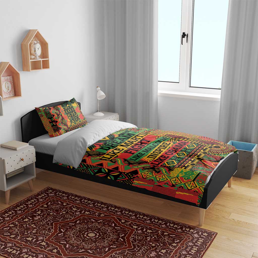 Multicolor bedding set on bed with bold geometric design and “DREAM LIKE …” text center