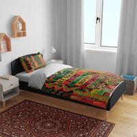 Multicolor bedding set on bed with bold geometric design and “DREAM LIKE …” text center