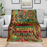 Colorful throw blanket draped over gray sofa, visible multicolor motif