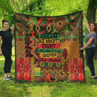 Large multicolor quilt with tribal-style patterns and stacked inspirational text.