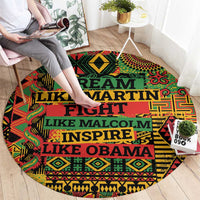 Round area rug, multicolor geometric pattern with large stacked text in teal and red
