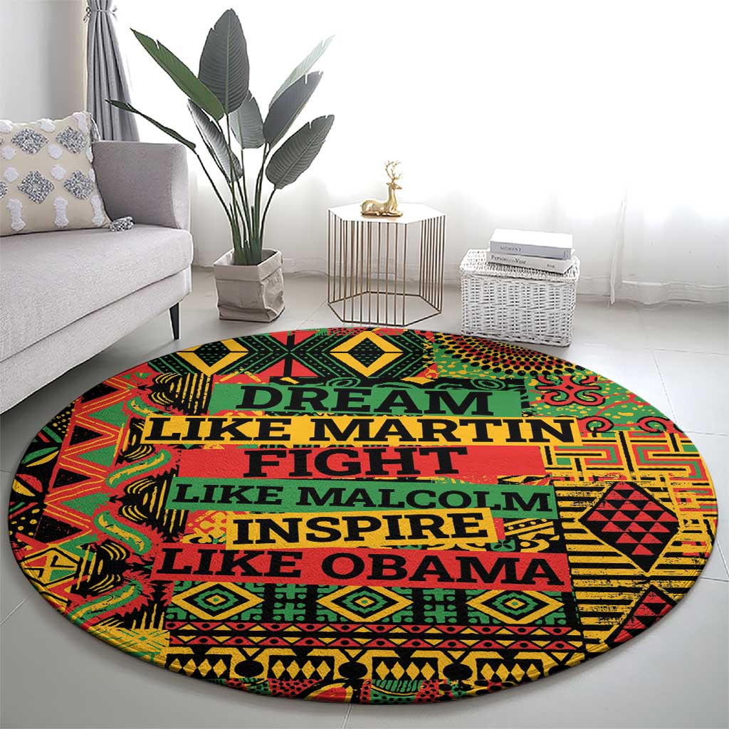 Round area rug with vibrant geometric design and stacked slogan text in dark green and yellow