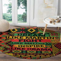 Round area rug with colorful geometric motif and prominent teal slogan text on black