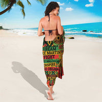 Colorful sarong skirt with back tie straps and bold centered text graphic