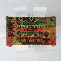 Colorful patterned tablecloth with bold text in green, red, yellow, black