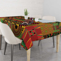 Colorful patterned tablecloth over dining table with corner drop in green, red, yellow