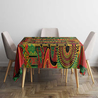 Colorful geometric tablecloth with decorative edge on dining table in green and red